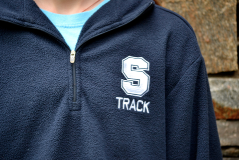 A student throws on her comfy ASF track fleece after a meet.