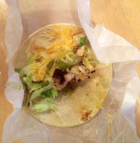 This delicious soft shell taco is stuffed with chicken, lettuce, and cheese.