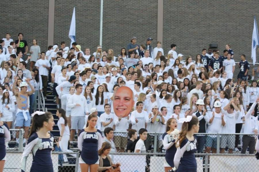 Superfans soak up the spirit at the annual white-out game. Photo by Griffin Thrush 15.