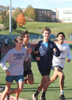 Running on the track (from left to right) Connor Teran ’17, Zak Ahmad ’17, James Lewis ’16 and Luis Cruz ’15 work on their times during varsity track’s practice. The team placed second in the recent FCIAC competition.
