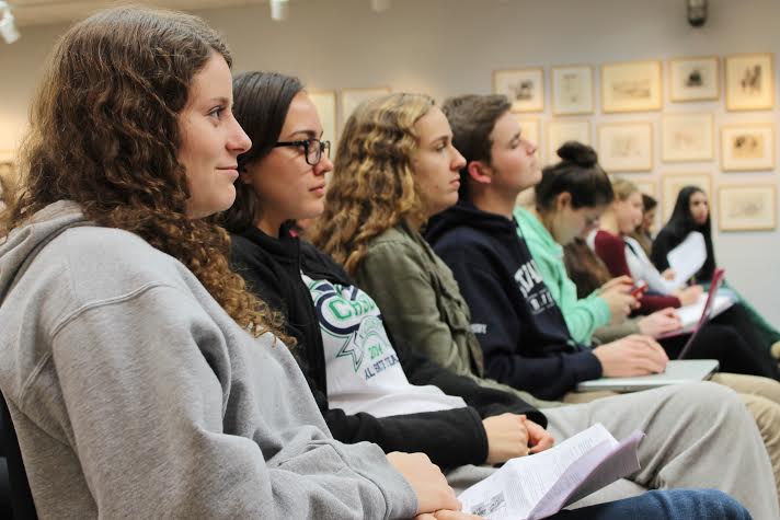 AP Environmental Science students Julie Bender 15, Olivia Jones 15, Emily Wolfe 15 and August Densby 15 listen intently to Eric Starbucks information on the history of Ebola. 
