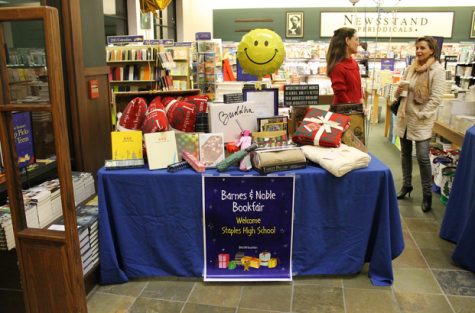 In the entrance of Barnes and Noble, books, gifts, and other products welcome customers.