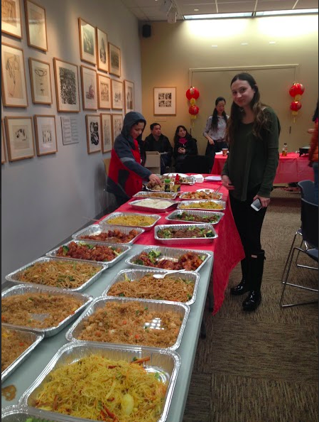 Catherine Delaurentis '17 poses in front of the endless Chinese food served at the Festival. 