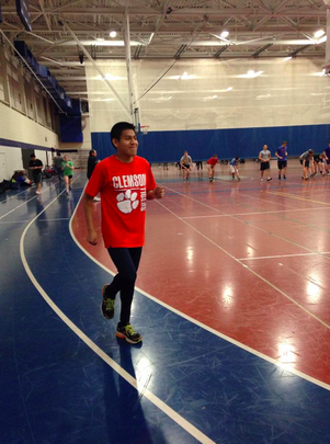Luis Cruz ‘15 runs on the Staples indoor track during his off season to prepare for outdoor track and field.