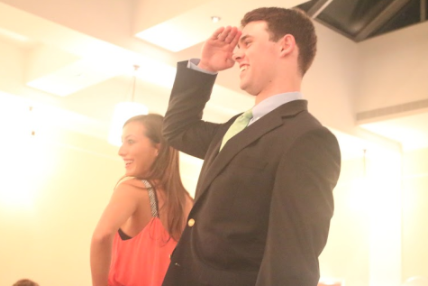 Slone Cooper and Teddy Coogan ’15 please the crowd with a fun pose at the end of the catwalk. 