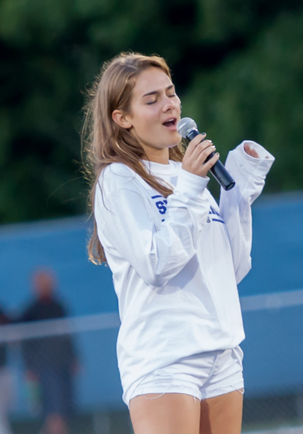 Kate Griffin ’17 singing the national anthem at Staples first home game of 2015.
