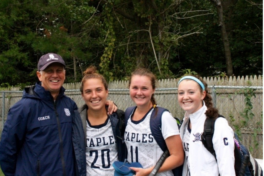 Staples coach, Ian Tapsall and captains (left to right) Christine Taylor ’18, Colleen Bannon ’17 and Chloe Deveny ’17 sport smiles after their tie with the defending state champions, the Wilton Warriors. 
