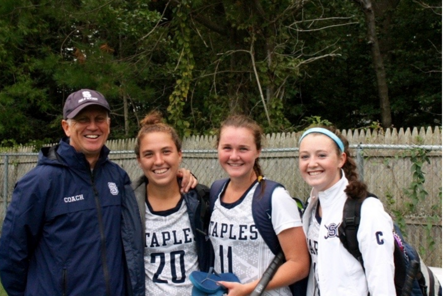 Staples coach, Ian Tapsall and captains (left to right) Christine Taylor ’18, Colleen Bannon ’17 and Chloe Deveny ’17 sport smiles after their tie with the defending state champions, the Wilton Warriors. 
