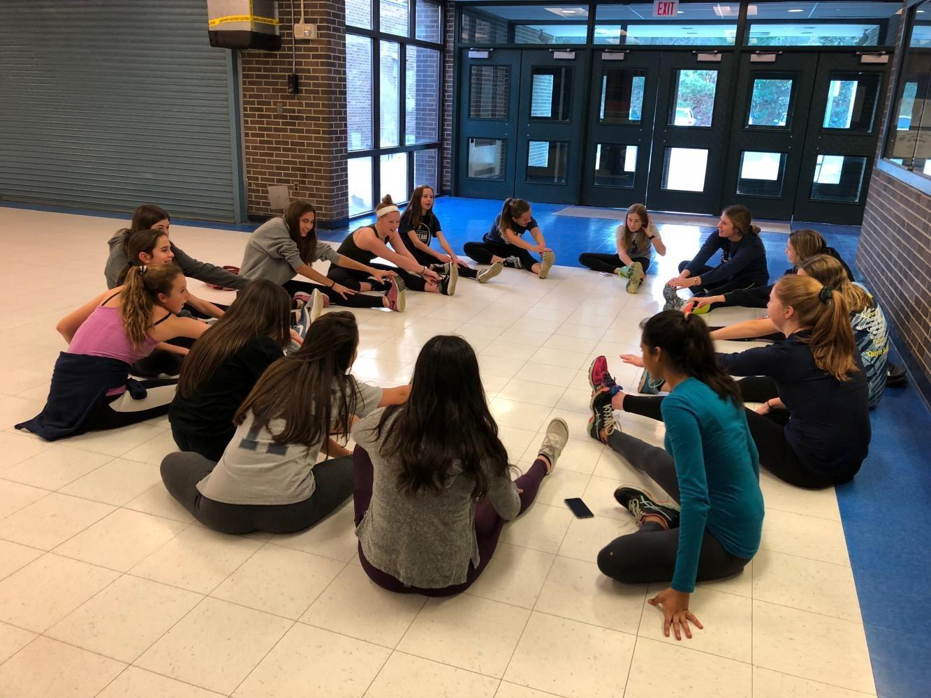 Staples girls’ ski team prepares to put on their skis for the season