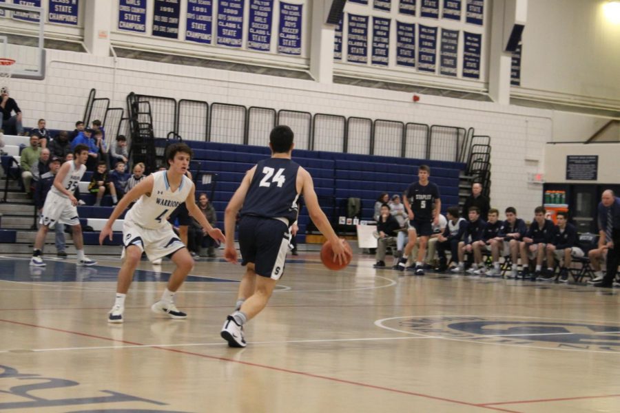 Boys basketball gets signature win at Wilton