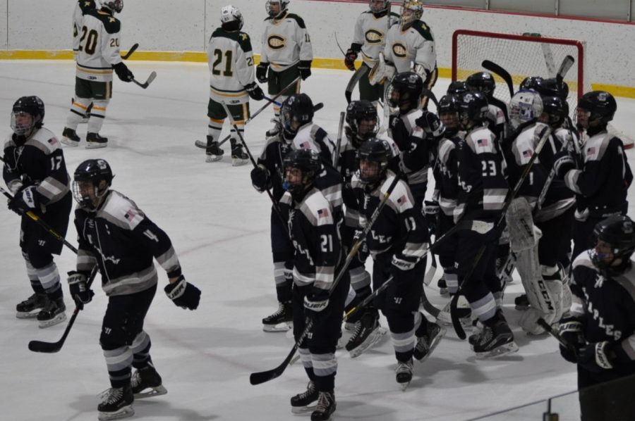 Staples boys hockey defeats Trinity in overtime game