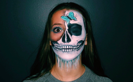 Emmy Marcus ’22 poses for a picture on her instagram displaying her detailed artwork that she created on her face. 