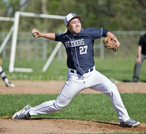 Chad Knight ’19 is in the middle of his delivery as throws against Brian McMahon High School at McMahon.