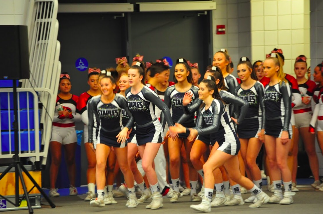 The cheer team gets excited as they begin to run onto the mat and start their performance at regionals. 

Photo contributed by Harley Bonn 21
