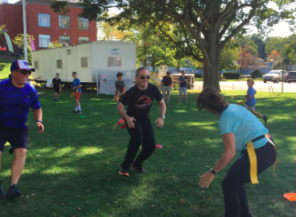 Westport police officers smile while participating in Capture-A-Cop, a capture the flag game between Westport middle school students and local law enforcement on Sunday, Sept. 15. 