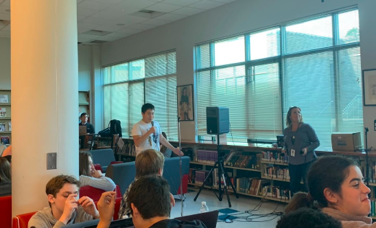 William Jin ’23 sings ‘September’ by Earth, Wind & Fire during karaoke in the library.