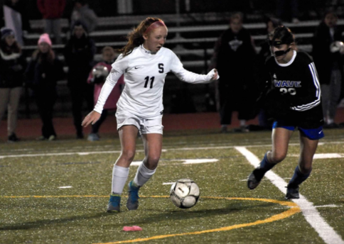 Autumn Smith 21 dribbles past Darien defender with ease.
