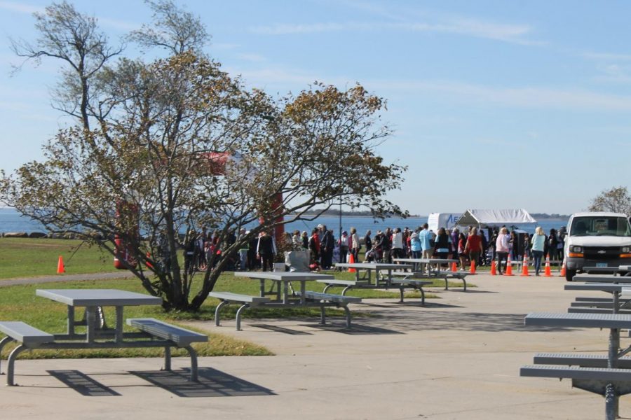 Local residents walk to the start of the Walk to Defeat ALS on Saturday, Oct. 19. 