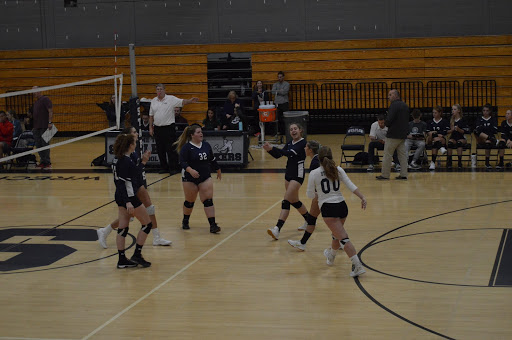 Staples celebrates a hard fought point during their game against Greenwich on Thursday, Oct. 3. Greenwich won the game, winning all three sets and extending their undefeated winning streak. The Wreckers fell to a 4-4 record.
