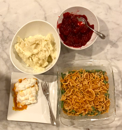 The final look of all the food made in the video. The top left is mashed potatoes, bottom left is a sweet potato and marshmallow casserole, bottom right is a green bean casserole, and finally the top right is a side of cranberry sauce. 