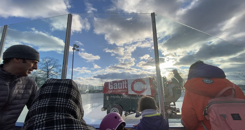 People watch as the zamboni at Longshore Ice Rink resurfaces the ice, preparing for a packed rink on Sunday afternoon.