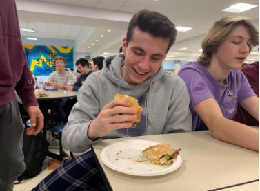 Nick Armentano ’22 enjoys a sandwich from the Staples cafeteria.