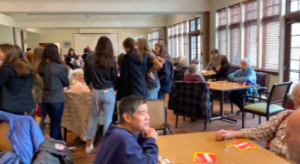 People of all ages ranging from elementary school cheerleaders, to high school athletes, to seniors all gather at the Senior Center for the annual Super Bowl Party.