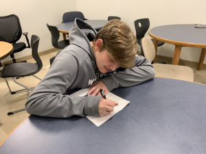 Jake Ment ’22 imitates taking the PSAT which took place on March 4 and 5. Upperclassmen got to come in late both days so freshmen and sophomores could take the test. 