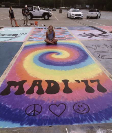 School parking lot with all personalized spots that students created on their own.