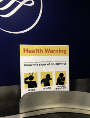This sign at LaGuardia Airport warns of the coronavirus weeks before schools close. 