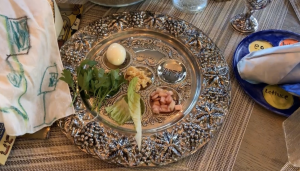 This is called a seder plate which is used on Passover. Each food is symbolic to the story of Passover. For example, parsley is a bitter herb and bitter herbs represent the bitterness of slavery. 