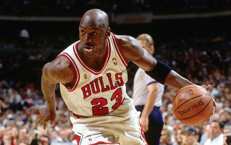 Michael Jordan drives to the hoop with determination 
