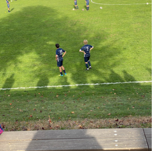 Alan Fiore (right) looks on to Loeffler Field prior to a contest against Ridgefield, in which he scored two of his four goals so far on the year. 