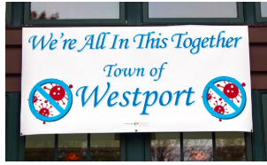 This banner on the door of the Westport Senior Center aims to brighten people’s day as they attend one of the Senior Center’s COVID programs, free drive by grocery pick up.  