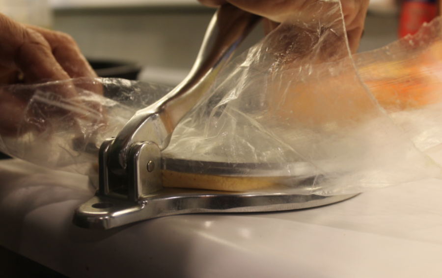 Putting saran wrap on the tortilla press makes it easier to mold and handle the dough, and makes for an easier cleanup afterwards.