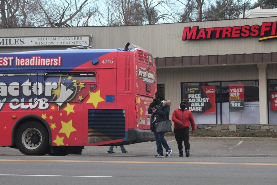 With the lack of bus shelters, commuters like the ones pictured, come dangerously close into Post Road. As Westport operates under a “flag system,” many stops are entirely unmarked.