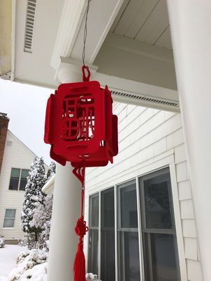 Couplets are hung outside houses to protect the household from evil and welcome prosperity.