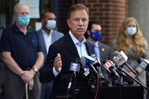 Governor Ned Lamont speaks at a press conference regarding COVID-19. The updated approach announced Monday will be age-based and allow exceptions for educators and childcare providers.  