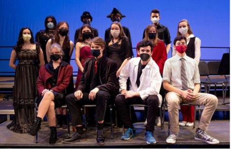 Players’ Dracula cast don red and black costumes for the show as well as coordinating masks.