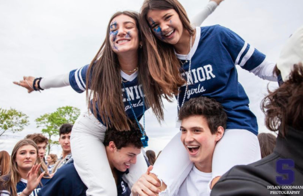 Students coming together at Compo Beach. All senior girls wore their senior shirts and boys wore Staples merch.