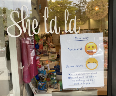 She La La, a retail business, along with other buildings in Westport, have put signs in their storefront to inform customers of their mask policy.