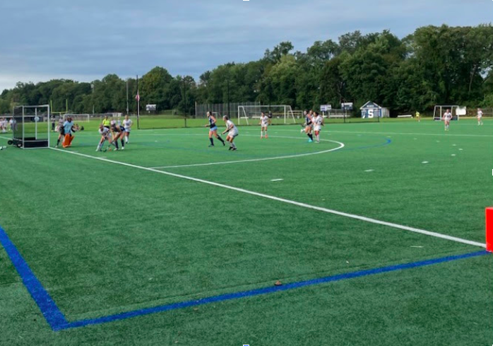 Staples offense battles for a shot on goal in Wilton territory in an effort to increase their 2-1 lead.