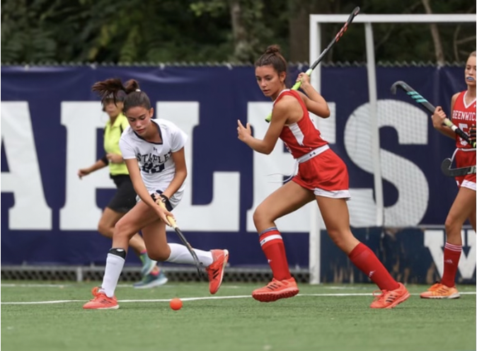 Sofia Fidalgo-Schioppa ’25, left, steals the ball from a Greenwich player. 