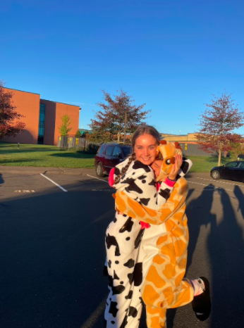 Senior girls dress up in pajamas and arrive early to school to have a photoshoot in the parking lot for all days of spirit week.