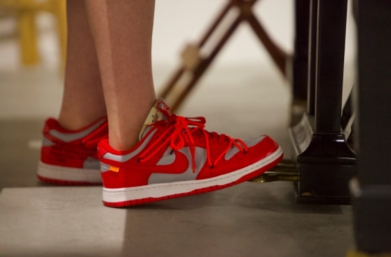 Logan Goodman ’24 is wearing red Nike Off-White x Dunk Low University sneakers. Virgil Abloh designed and released these shoes with Nike on Dec. 20, 2019. 