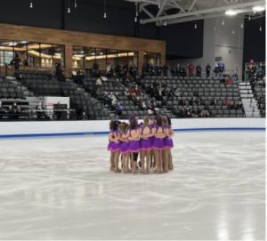 Beirne and her team huddle up moments before their competition. This helps the team settle their nerves.
