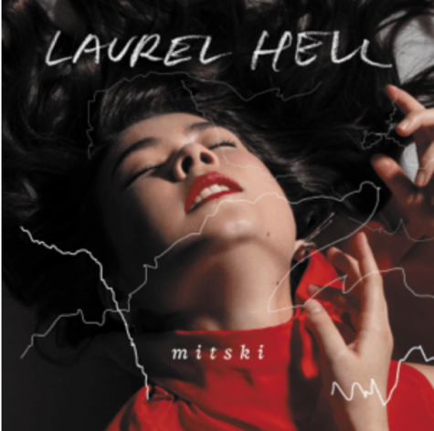 Mitski is depicted in a matching red outfit and lipstick for the “Laurel Hell” Album cover.
