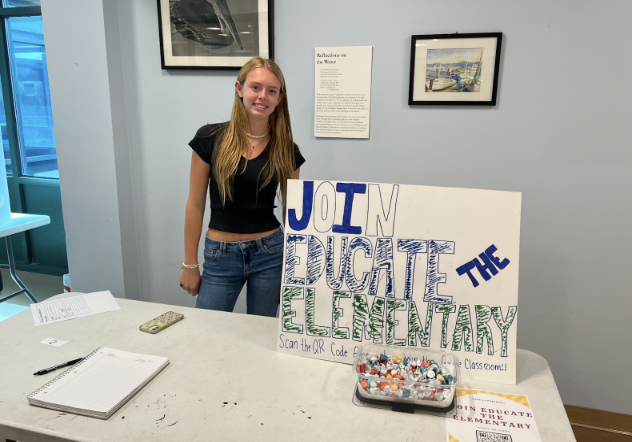 Kaya Law ’24 runs Anya Nair’s ’24 Educate the Elementary club stand. This club had over five pages of students eager to sign up.