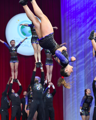 Cheerleader Jenny Bradshaw demonstrates a full, one of the most challenging tumbling skills, during her competition at the Cheerleading World Championships.