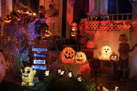 A house beckons the arrival of trick-or-treaters with extensive decorations.